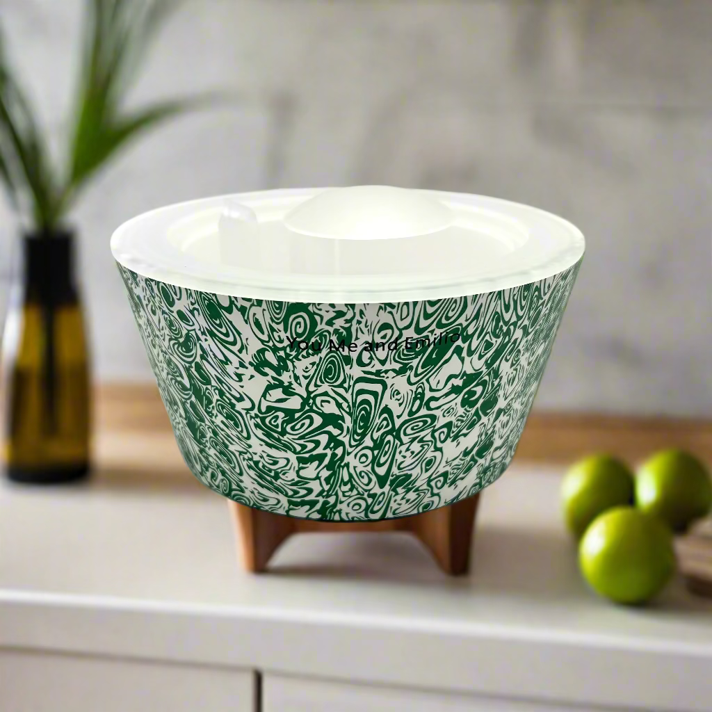Ceramic bowl with green and white pattern on a white background
