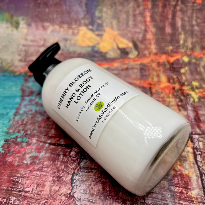 Cherry Blossom Hand & Body Lotion applied to hands, highlighting its nourishing and hydrating properties with soft, glowing skin.