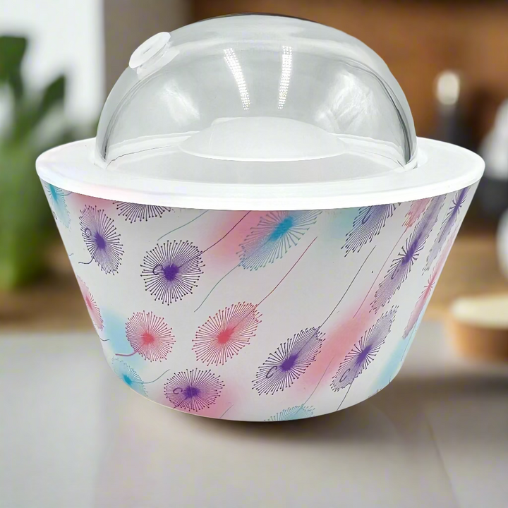 Container with floral pattern and clear lid on a white background