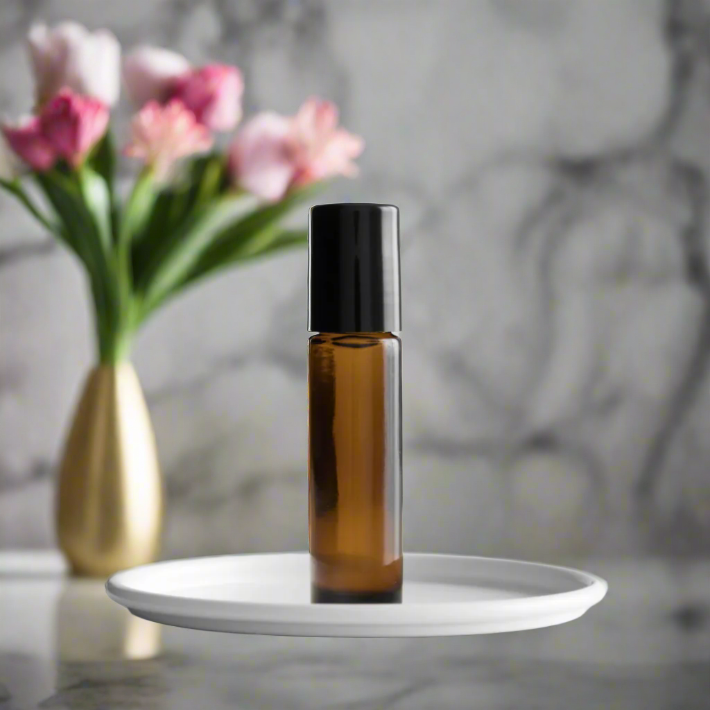 Amber glass bottle of Forty Scented Roll-On by You Me & Emilio, featuring bold musky and floral fragrance oil for daily wear, luxury scent rituals, and gifting.