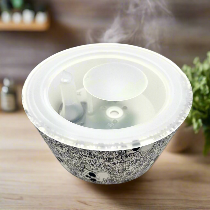 Decorative flowerpot with intricate black patterns on a white background