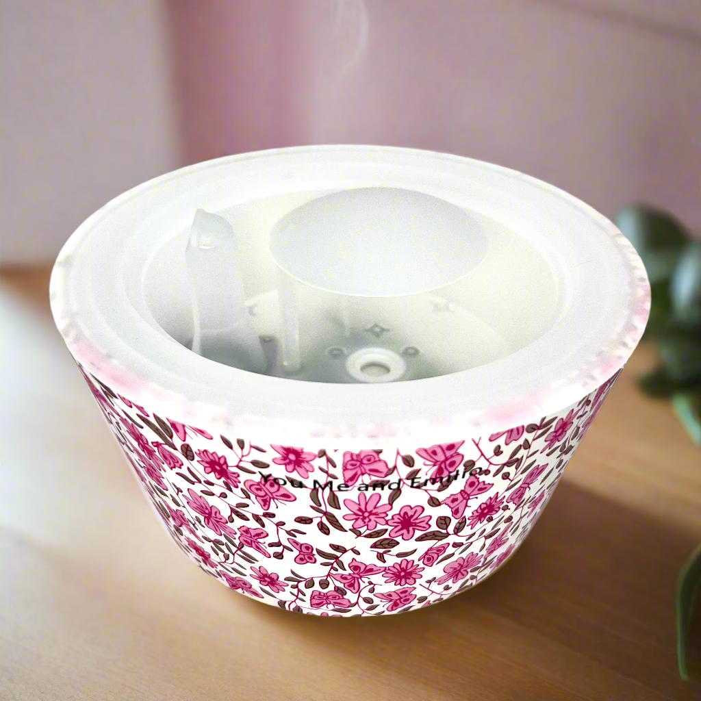 White container with pink floral pattern on a white background