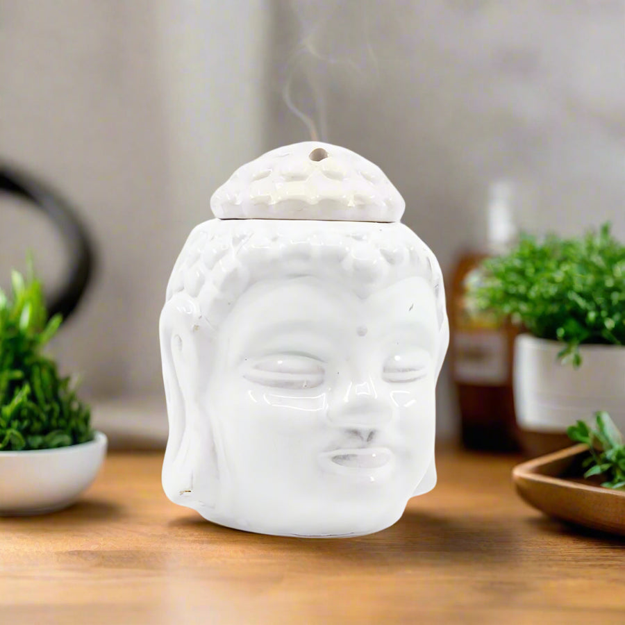 Buddha Tea Light Wax Warmer

Immerse yourself in a world of tranquility and aromatic bliss with our Buddha Head Tea Light Wax Warmer. Crafted with pristine ceramic, this exquisite Buddha head brings a sense of serenity and elegance to any interior.
