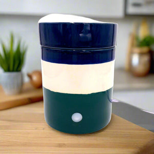 Fragrance & Soy Wax Warmer

Elevate the ambiance of your living space with our Fragrance Soy Wax Warmer. Delight in the luxurious scent of "You Me &amp; Emilio" as it fills the air, creating an atmosphere of elegance and exclusivity.